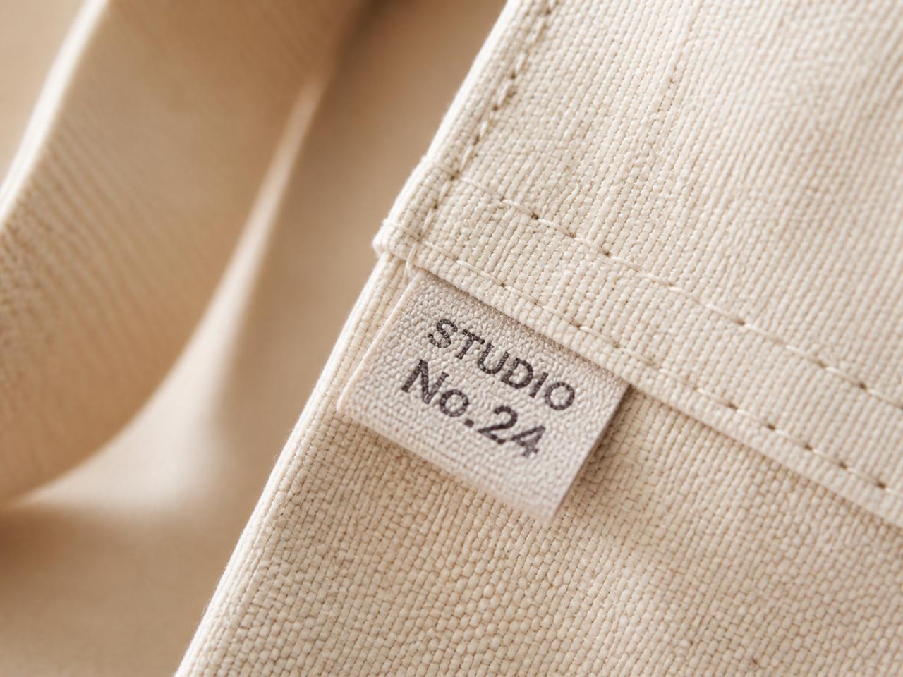 Close-up of soft cotton canvas and a wooden pole on a Play Tents teepee in a sunlit room